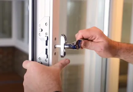 Person unlocking Everest conservatory door handle