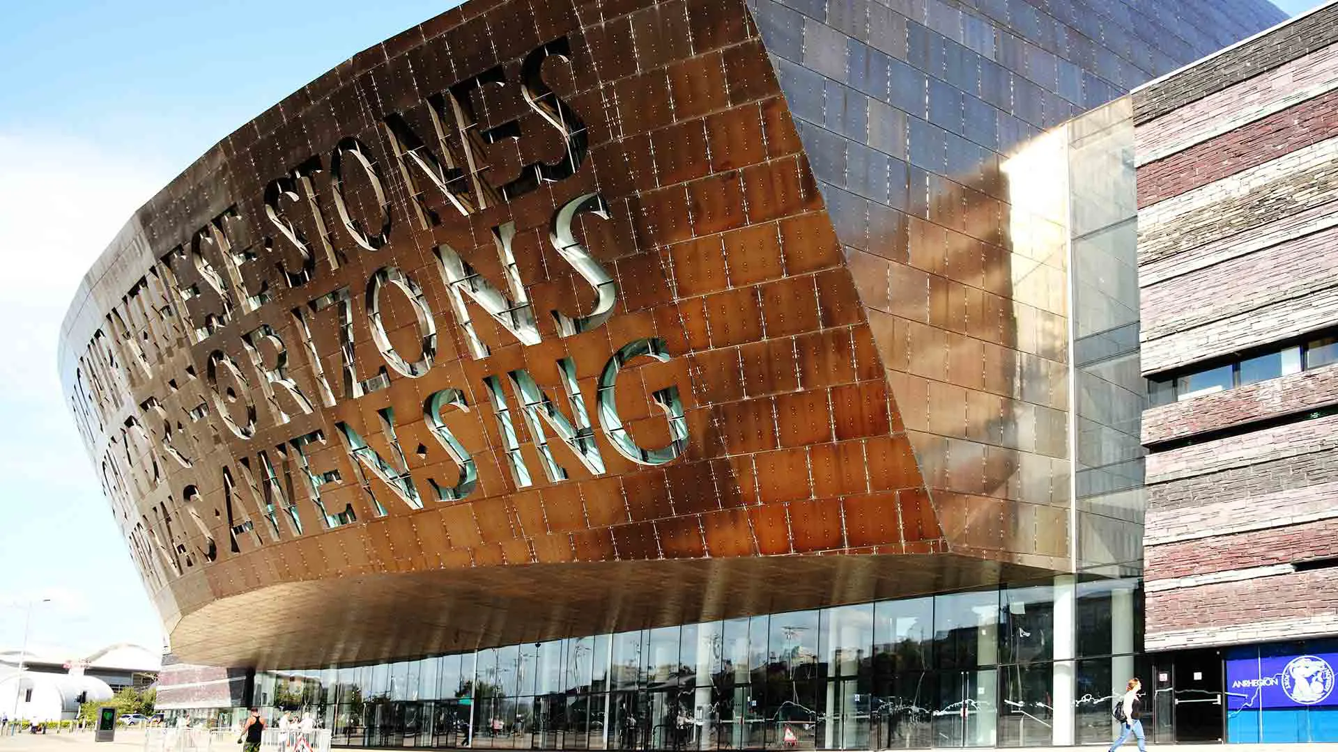 Copper building with words carved into the facade