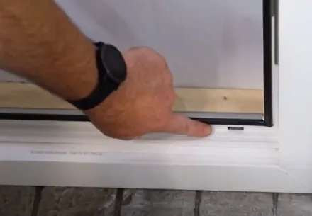 Hand installing window seal Everest conservatory