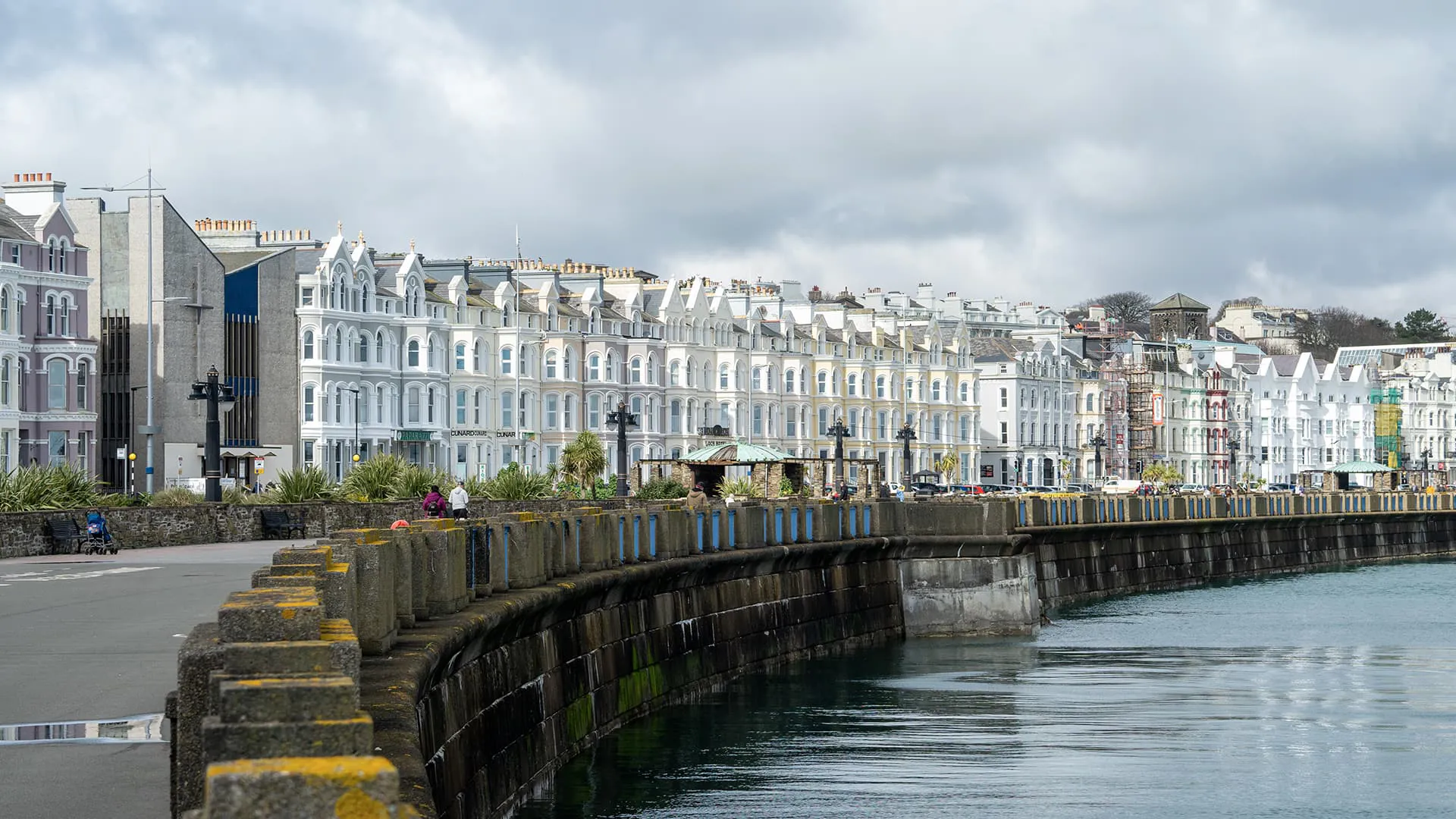Coastal town with multi-coloured buildings by water