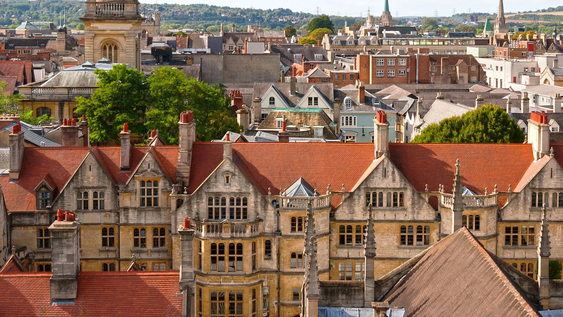City rooftops with terracotta tiles and stone buildings