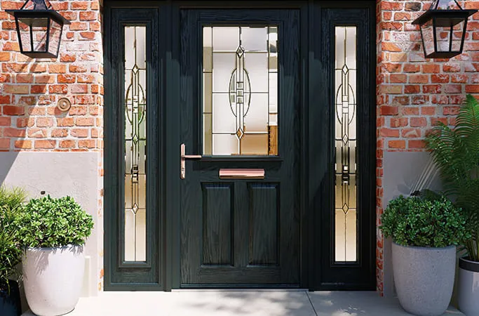 Dark green door with decorative glass panels
